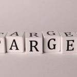 White cubes spelling 'TARGET' on a neutral background, ideal for business or marketing concepts.